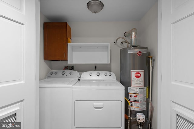 2926 Yorkway, Baltimore, MD 21222 - laundry room with water heater, cabinet space, and washer and dryer