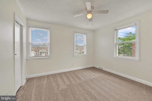 6824 Duluth Ave, Dundalk, MD 21222 - unfurnished bedroom featuring light colored carpet, baseboards, and a ceiling fan