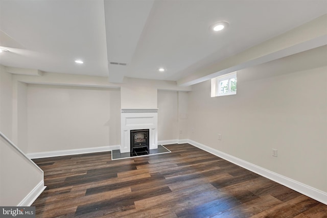 6824 Duluth Ave, Dundalk, MD 21222 - unfurnished living room featuring dark wood finished floors, recessed lighting, baseboards, and a wood stove