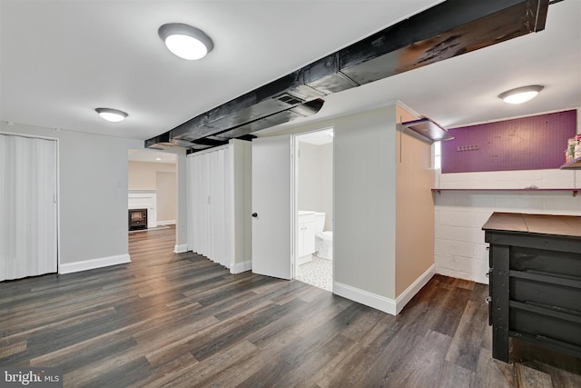6824 Duluth Ave, Dundalk, MD 21222 - finished below grade area featuring wood finished floors, baseboards, and a fireplace