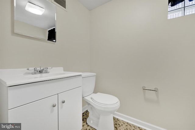 6824 Duluth Ave, Dundalk, MD 21222 - half bath featuring toilet, baseboards, and vanity