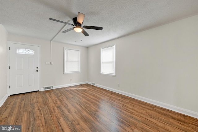 6824 Duluth Ave, Dundalk, MD 21222 - entryway featuring baseboards, a ceiling fan, plenty of natural light, and wood finished floors