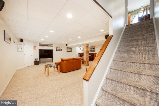 staircase featuring baseboards, recessed lighting, carpet, and a paneled ceiling