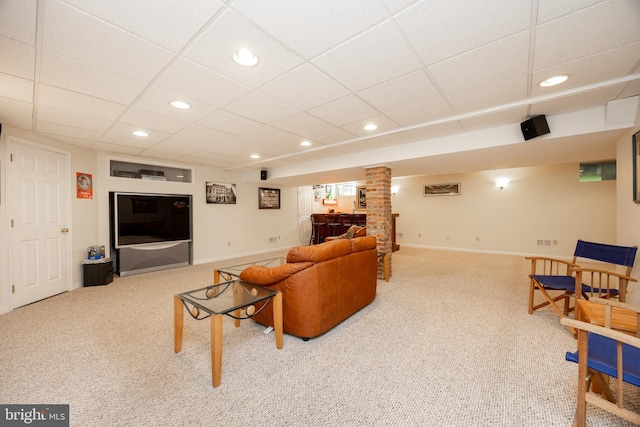 living room featuring baseboards, carpet flooring, recessed lighting, and a paneled ceiling
