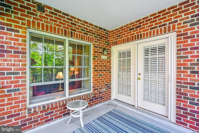 12030 Tralee Rd Unit 304, Lutherville Timonium, MD 21093 - property entrance with a porch, french doors, and brick siding