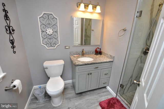 full bath with baseboards, wood finished floors, and a shower stall