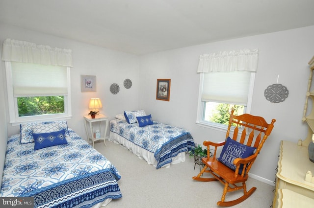bedroom with carpet flooring and baseboards