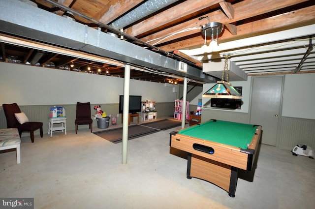 rec room with concrete floors, wainscoting, and billiards