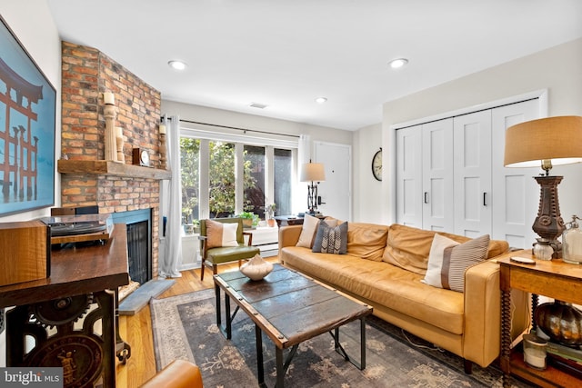 1 Christian St Unit 44L, Philadelphia, PA 19147 - living room featuring visible vents, recessed lighting, wood finished floors, and a fireplace