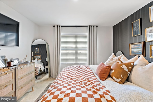 bedroom featuring light carpet