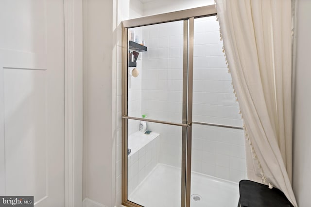 bathroom with a shower stall