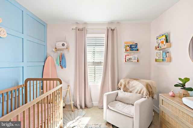 bedroom featuring a nursery area