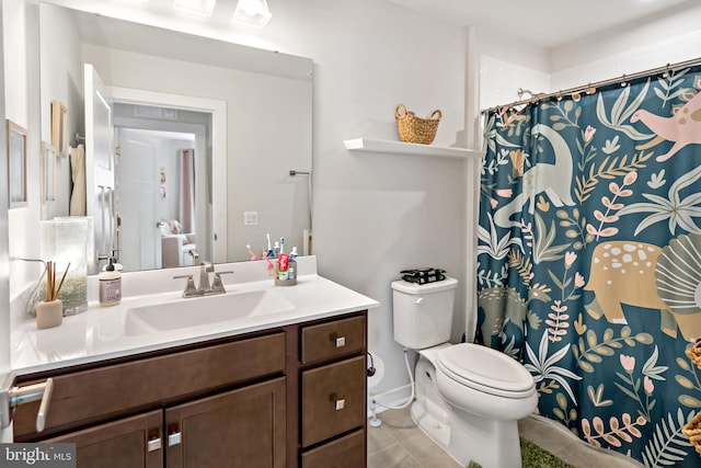 bathroom with tile patterned flooring, a shower with shower curtain, toilet, and vanity