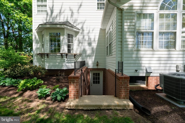 back of house featuring central AC