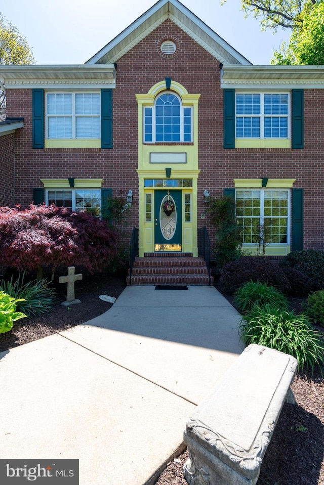 view of front of home with brick siding