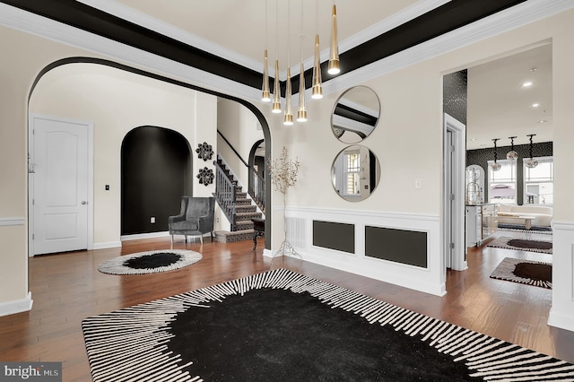 6206 Payton Way, Frederick, MD 21703 - entrance foyer featuring an inviting chandelier, wood finished floors, arched walkways, ornamental molding, and stairs