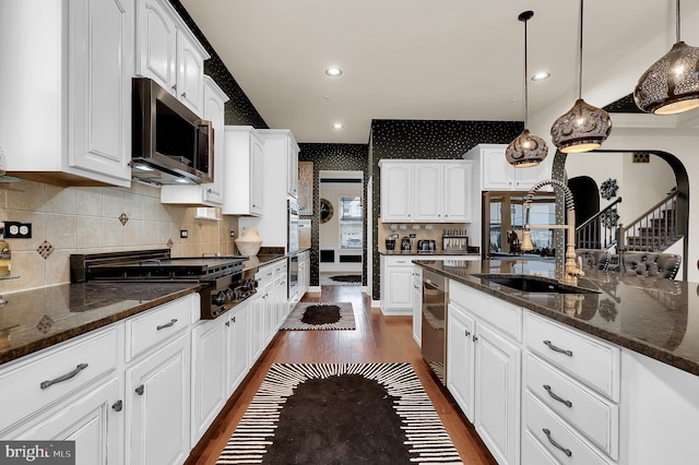 6206 Payton Way, Frederick, MD 21703 - kitchen with a sink, stainless steel appliances, dark stone counters, dark wood finished floors, and white cabinetry