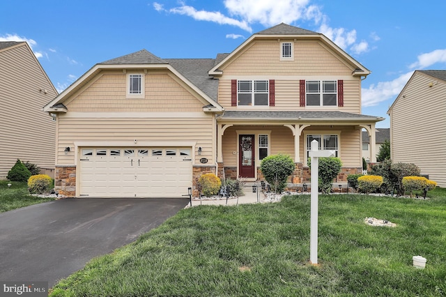 6206 Payton Way, Frederick, MD 21703 - view of front of house with stone siding, driveway, and a front lawn