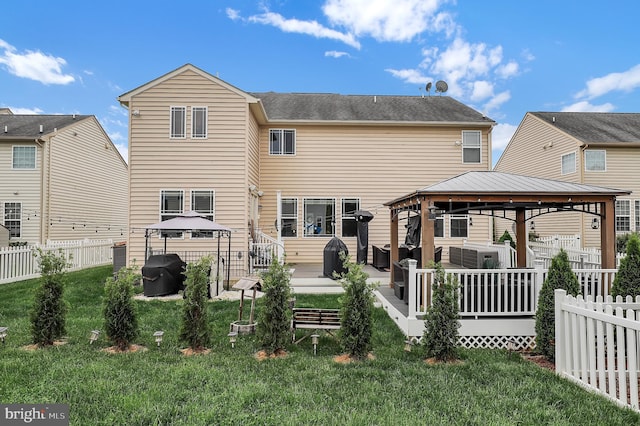 6206 Payton Way, Frederick, MD 21703 - back of house with a yard, a gazebo, and a fenced backyard