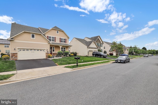 6206 Payton Way, Frederick, MD 21703 - view of front of property featuring stone siding, a residential view, aphalt driveway, and a front lawn