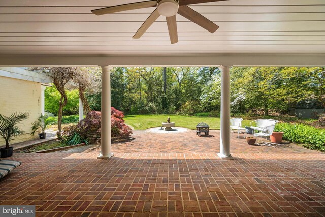 view of patio featuring ceiling fan