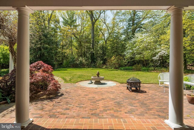 view of patio / terrace with a fire pit