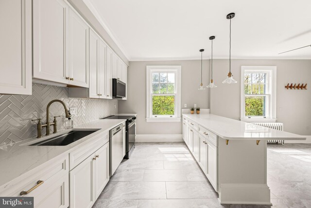 kitchen with decorative backsplash, a peninsula, radiator heating unit, a sink, and dishwasher