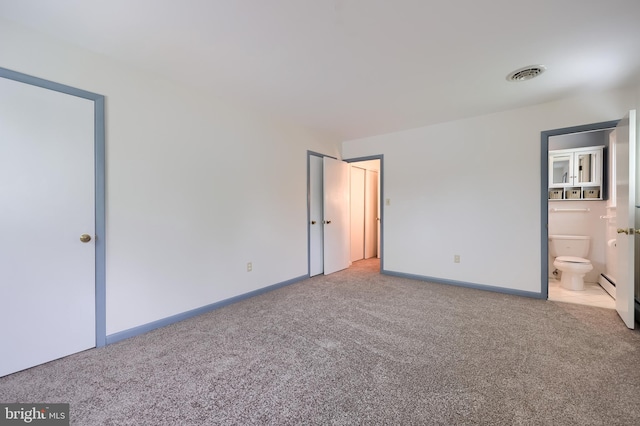 unfurnished bedroom featuring visible vents, connected bathroom, carpet, and baseboards
