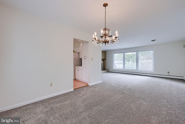 empty room featuring baseboards, a baseboard heating unit, a notable chandelier, and light carpet