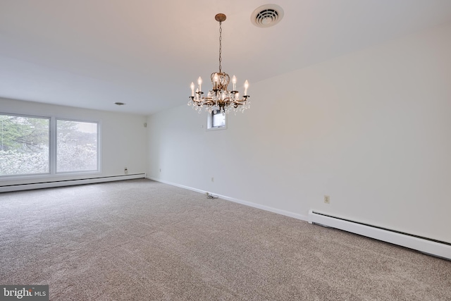 spare room featuring visible vents, carpet flooring, a baseboard heating unit, and baseboard heating