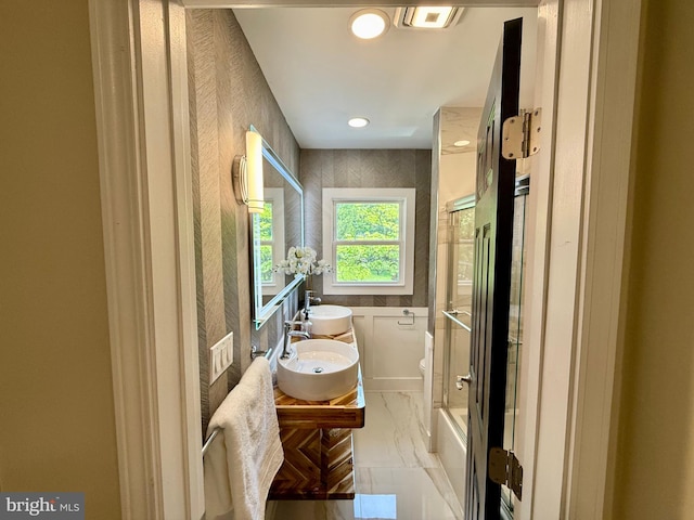 9905 Stoughton Rd, Fairfax, VA 22032 - bathroom with recessed lighting, toilet, marble finish floor, a sink, and double vanity