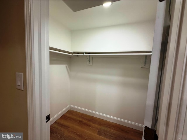 9905 Stoughton Rd, Fairfax, VA 22032 - walk in closet featuring dark wood-type flooring