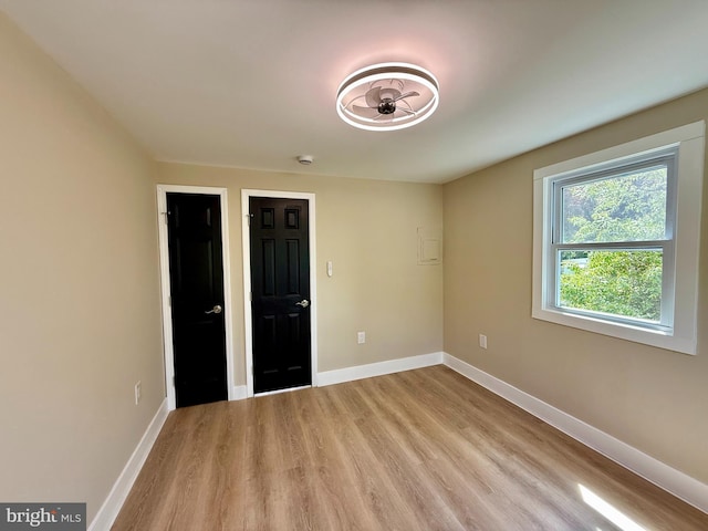 9905 Stoughton Rd, Fairfax, VA 22032 - unfurnished bedroom featuring baseboards and light wood-style floors