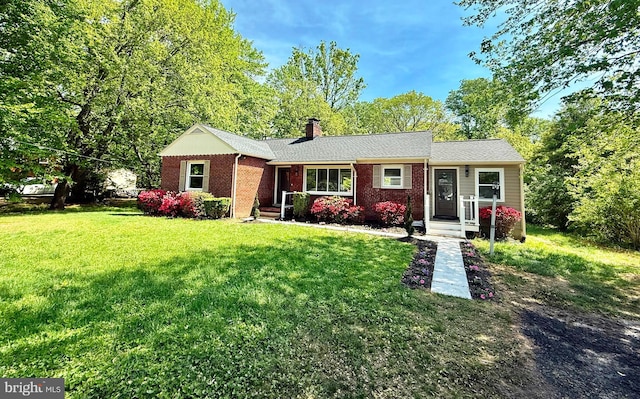9905 Stoughton Rd, Fairfax, VA 22032 - ranch-style home with brick siding, a chimney, and a front yard