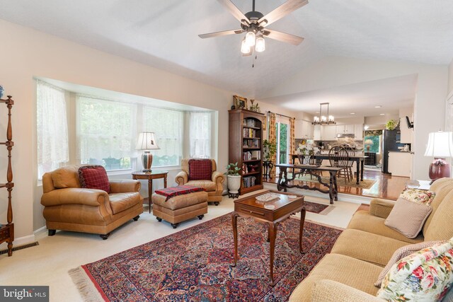 3635 Wessex Ln, Huntingtown, MD 20639 - living room featuring a chandelier, vaulted ceiling, and a ceiling fan