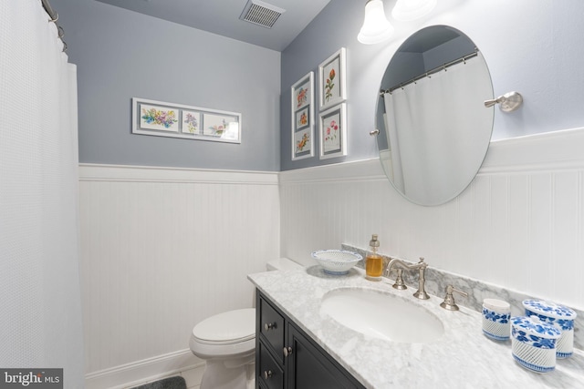 3635 Wessex Ln, Huntingtown, MD 20639 - full bathroom with wainscoting, toilet, and vanity