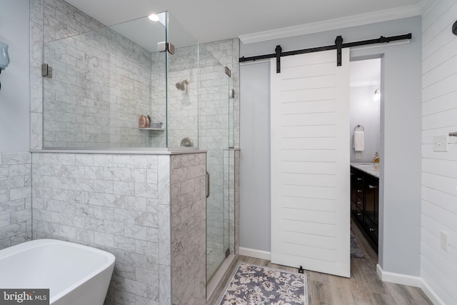 3635 Wessex Ln, Huntingtown, MD 20639 - bathroom with a shower stall, wood finished floors, a freestanding bath, vanity, and crown molding