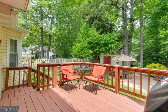 3635 Wessex Ln, Huntingtown, MD 20639 - deck featuring outdoor dining space, fence, and view of scattered trees