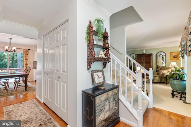 3635 Wessex Ln, Huntingtown, MD 20639 - foyer featuring hardwood / wood-style flooring, a chandelier, crown molding, and stairs