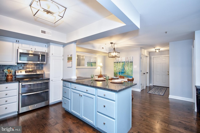904 Martell Ct Unit 904-E, Bel Air, MD 21014 - kitchen featuring stainless steel appliances, dark wood-style flooring, tasteful backsplash, and white cabinetry
