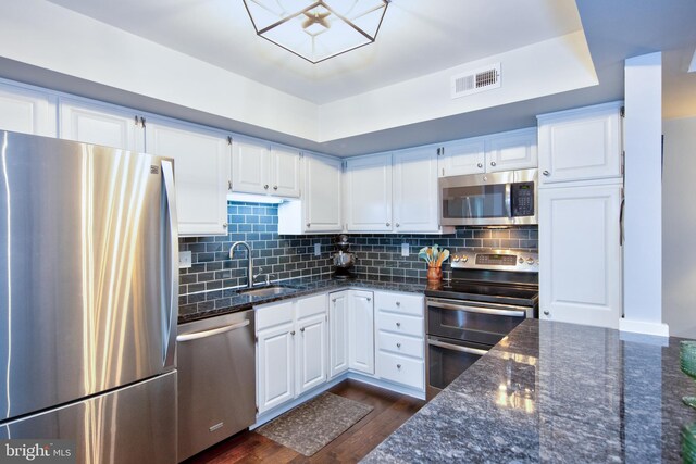 904 Martell Ct Unit 904-E, Bel Air, MD 21014 - kitchen with stainless steel appliances, a sink, white cabinetry, and dark stone counters