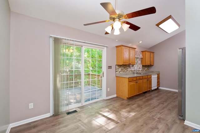 25 S Bearwood Dr, Palmyra, VA 22963 - kitchen with freestanding refrigerator, lofted ceiling, a ceiling fan, dishwasher, and a sink