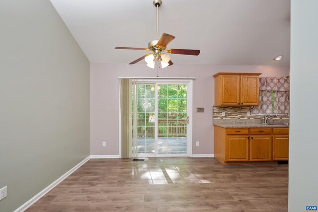 25 S Bearwood Dr, Palmyra, VA 22963 - interior space featuring light wood-style flooring, baseboards, ceiling fan, a sink, and light countertops