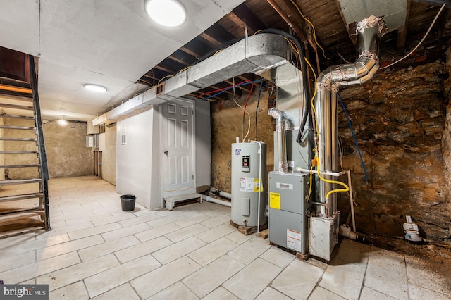 unfinished below grade area featuring electric water heater