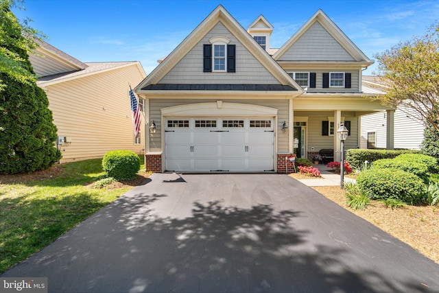 44516 Blueridge Meadows Dr, Ashburn, VA 20147 - craftsman house with covered porch, brick siding, and aphalt driveway