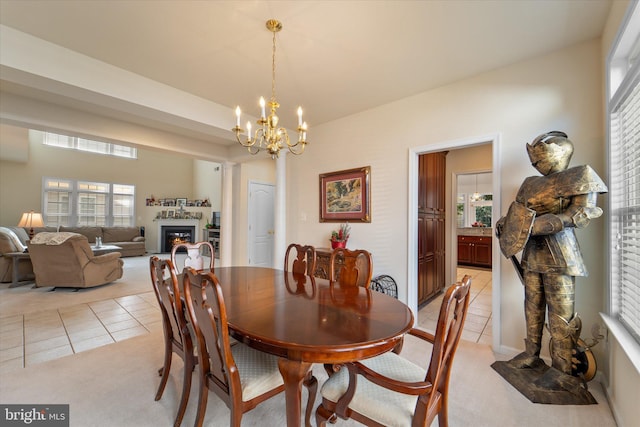 44516 Blueridge Meadows Dr, Ashburn, VA 20147 - dining room with a glass covered fireplace, light carpet, and light tile patterned floors