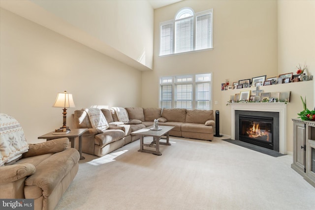 44516 Blueridge Meadows Dr, Ashburn, VA 20147 - carpeted living room with a fireplace with flush hearth, a high ceiling, and a wealth of natural light