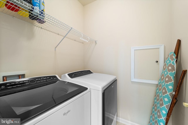 44516 Blueridge Meadows Dr, Ashburn, VA 20147 - laundry room featuring laundry area, baseboards, and independent washer and dryer