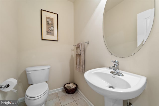 44516 Blueridge Meadows Dr, Ashburn, VA 20147 - half bathroom with toilet, baseboards, a sink, and tile patterned flooring