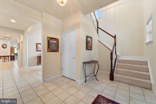 44516 Blueridge Meadows Dr, Ashburn, VA 20147 - entrance foyer featuring light tile patterned flooring, plenty of natural light, and stairway